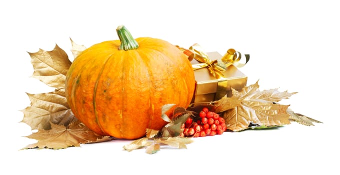 Halloween pumpkin with autumn leafs and gift isolated on white