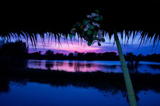 trees silhouette on sunset Thailand river