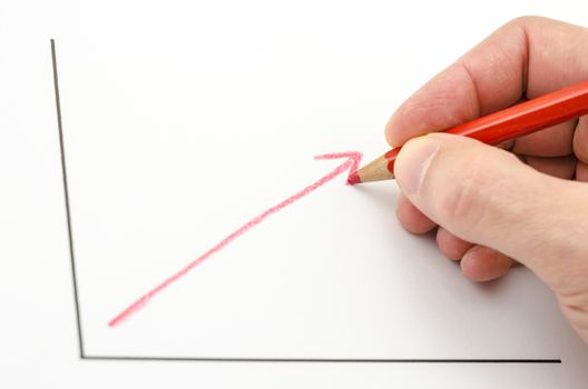 Hand drawing growing business graph with red arrow.