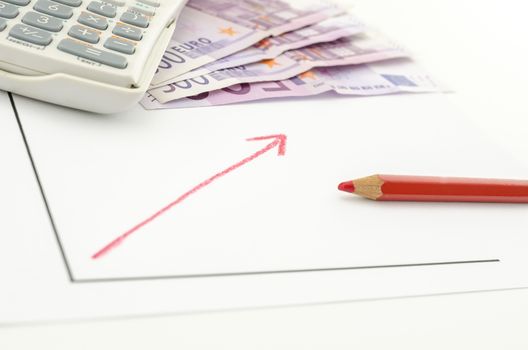 Growing business graph with red arrow with Euro banknotes and calculator in background.