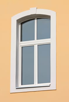 close up of window on orange wall