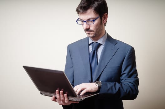 businessman with notebook on gray background