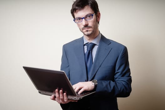 businessman with notebook on gray background