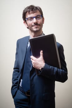 businessman with notebook on gray background