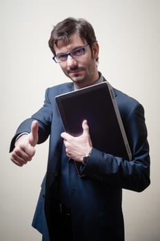 businessman with notebook doing ok on gray background