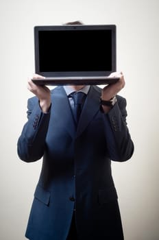 businessman with notebook in head on gray background