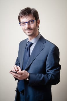 businessman on the phone on gray background