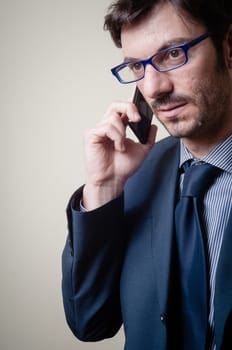 businessman on the phone on gray background