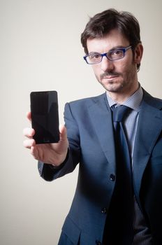 businessman on the phone on gray background