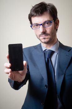 businessman on the phone on gray background