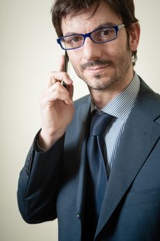 businessman on the phone on gray background