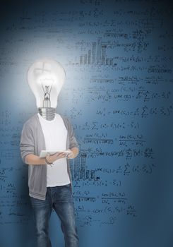 Boy with light bulb head lighting posing in front of blue board of maths problems