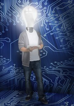 Student with light bulb head lighting in front of circuit board background