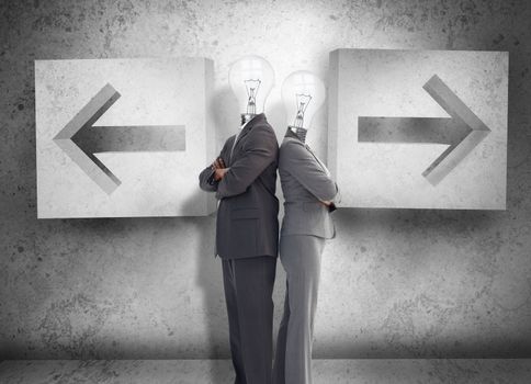 Business partners with heads for light bulbs standing back to back in front of two arrows on a grey wall
