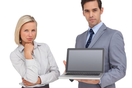 Business people presenting a laptop on white background