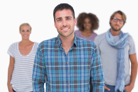 Smiling fashionable group portrait on white background