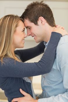 Couple looking into each others eyes and embracing