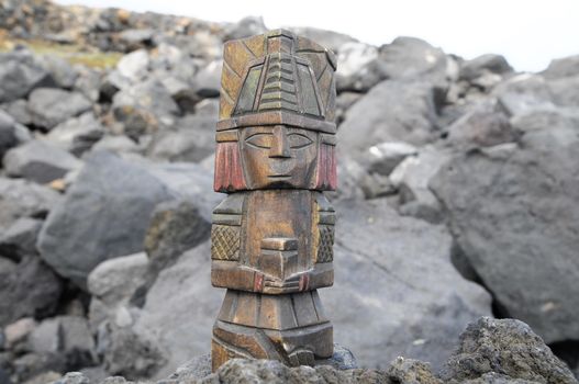 Ancient Maya Statue on the Rocks near the Ocean