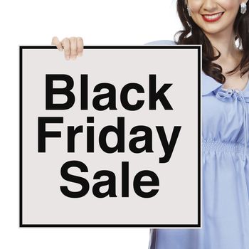 A woman holding a Black Friday sale signboard