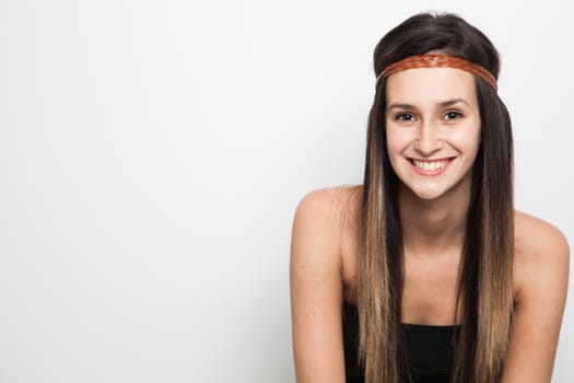 Young brunette woman posing with brown leather haed-band