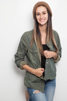 Young brunette woman posing on a white background