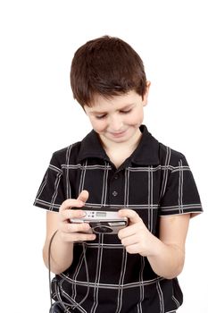 small boy checking analog camera settings on white background