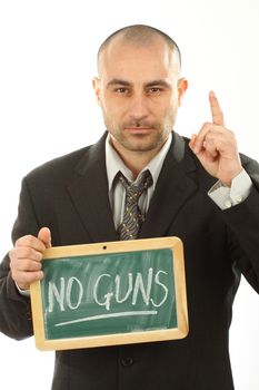 young man holding a sign saying no weapons