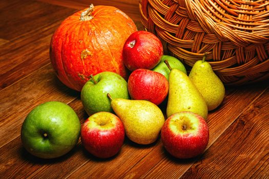 Harvest of ripe fruits and vegetables: apples, pears and pumpkin