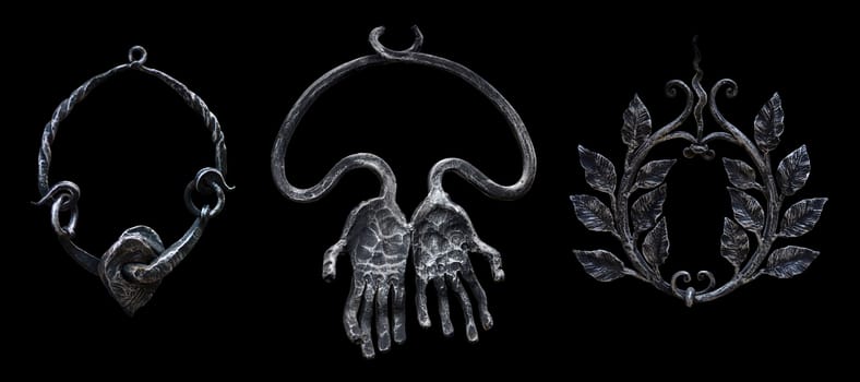 The 3 decorative forged metal pendants rings isolated on a black background