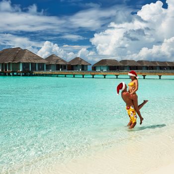 Couple on a tropical beach at Maldives