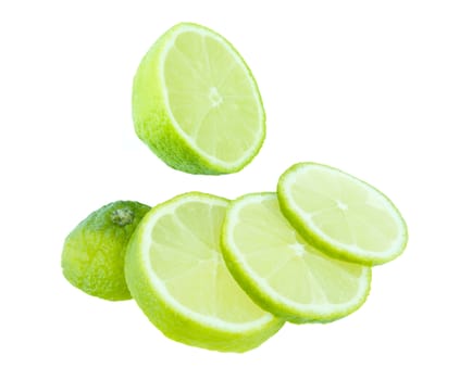 green lime fresh fruit slices isolated on white