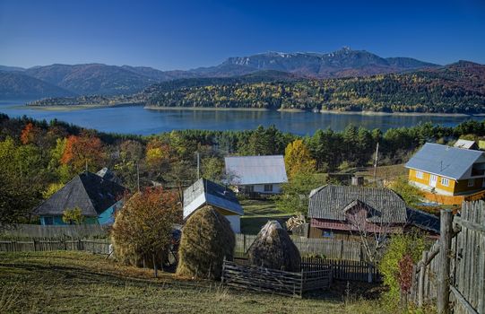 autumn mountain village rural landscape with lake