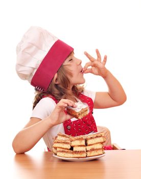 happy little girl cook with apple cakes
