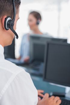 Business man with headset working in a call centre