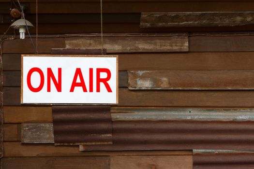 On Air Sign with old wooden wall background