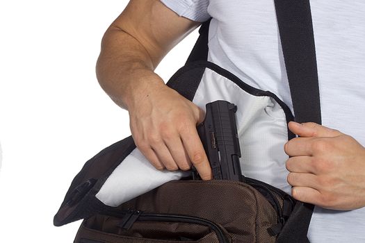 A student pulls a gun out of school bags.