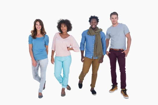 Young and fashion people posing against white background