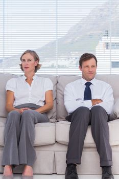 Business people waiting and sitting on couch