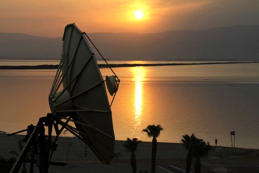 Satellite dish at beautiful sunrise background