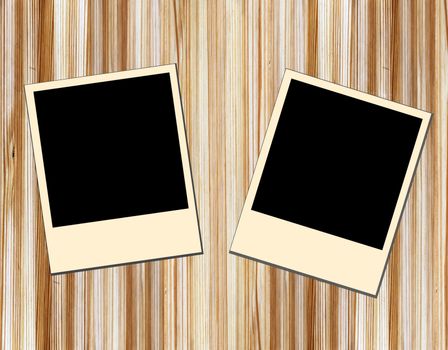 Blank old picture frames  on wooden background