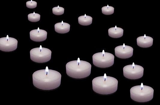 burning candles in the shape of a Star of David on the table