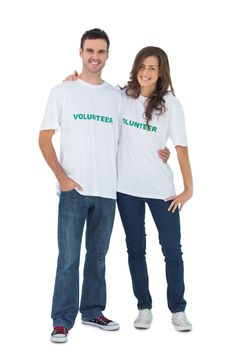 Two young people wearing volunteer tshirt on white background