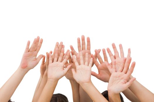 People raising hands in the air on white background