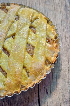 apple pie on an isolated wooden background