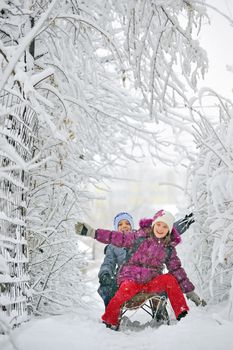  Kids sliding in winter time