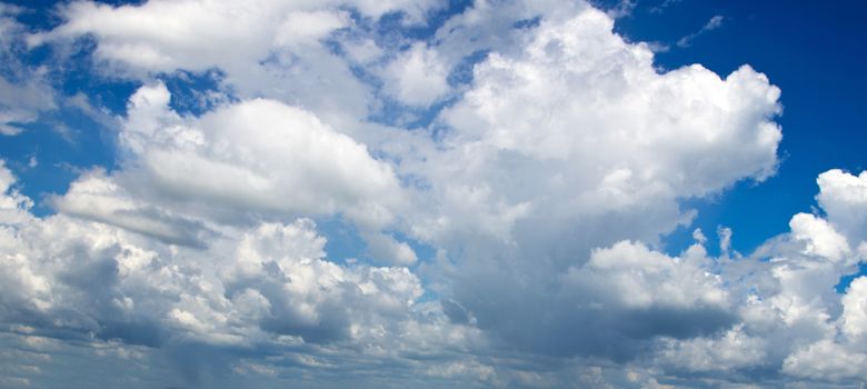 blue sky background with tiny clouds