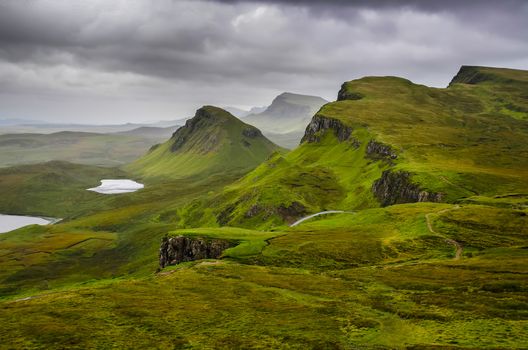 Scenic view of Quiraing mountains with dramatic sky in Scottish highlands, Isle of Skye, United Kingdom