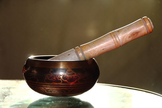 Tibetan singing bowl with a wooden stick