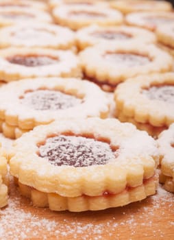 Closeup of Traditional Linzer Cookies on Wooden Board