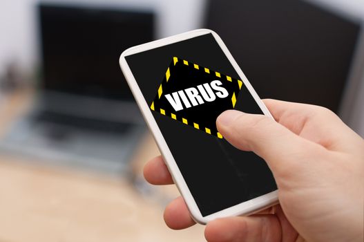 Man's Hand Touching Smartphone With Virus Alert on Display
